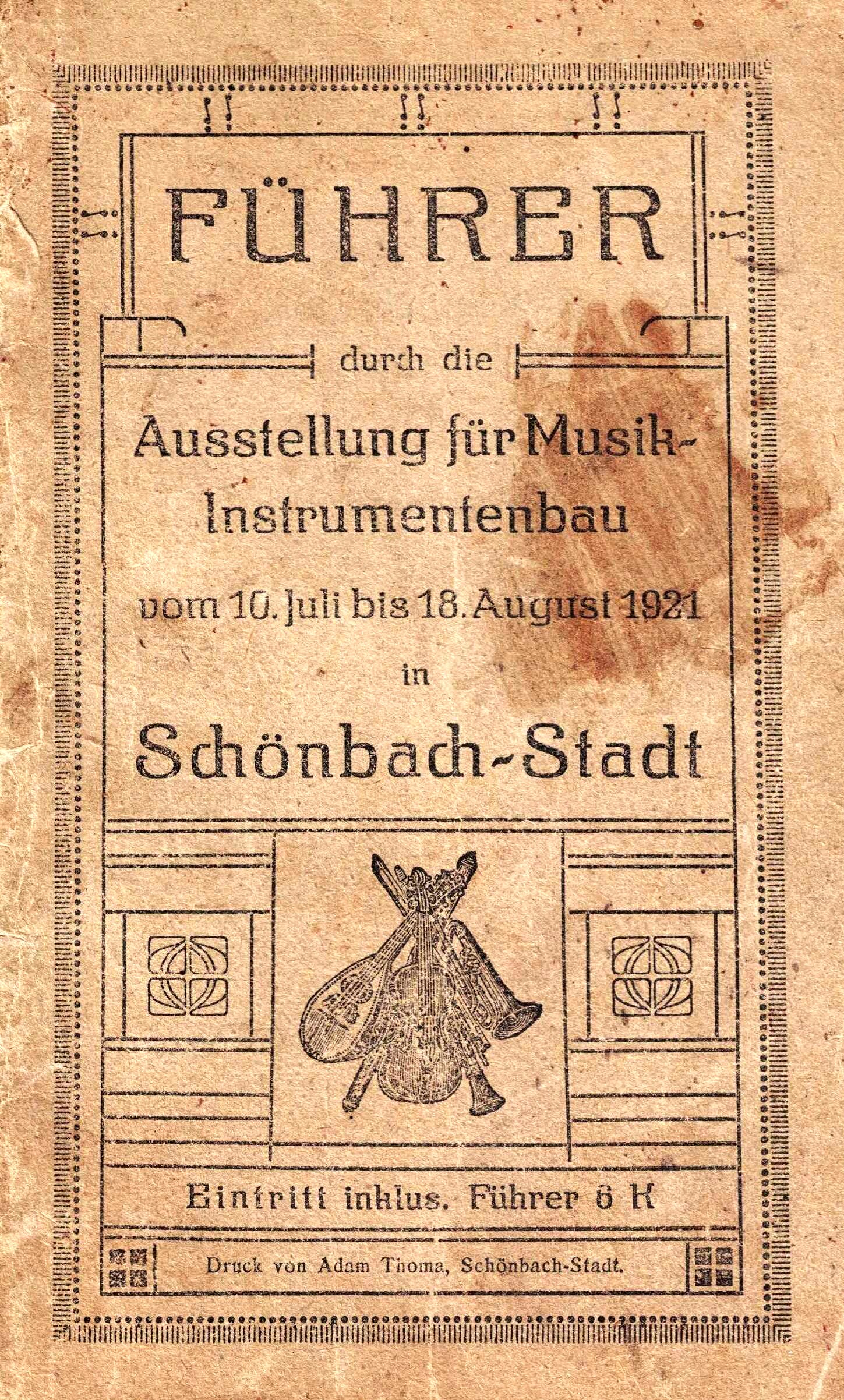 Aged brown cover of the 1921 exhibition guide “FÜHRER durch die Ausstellung für Musik-Instrumentenbau” in Schönbach-Stadt (10 July–18 August 1921), with a small engraving of clustered musical instruments and admission including guide for 5 crowns.